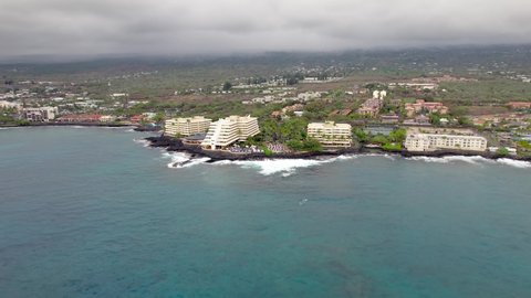 Kahaluu Bay and beaches on the Big Island of Hawaii with the Royal Kona Resort and other hotels - scenic aerial flyover