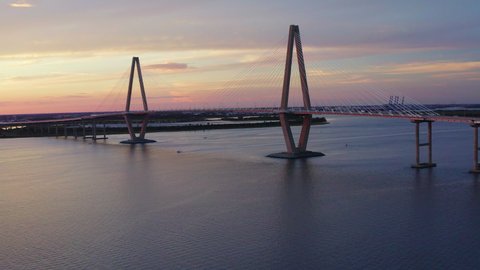 Drone Orbits Left Showing Cars Driving Across Cooper River Bridge in Charleston South Carolina