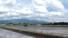 aerial view Tractor is plowing a rice field