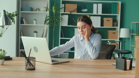 Office Syndrome.Woman Trying to Get Up From the Table Suddenly Feeling Pain in Back.Woman Feeling Tired of Long Sedentary Lifestyle Try to Relax and Relieve Pain by Rubbing Massaging Back and Waist