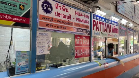 BANGKOK, THAILAND - Circa February, 2022 : Seller at Pattaya booth counter ticket kiosk calling for passengers at Bangkok bus terminal eastern Ekkamai. POV shot day time editorial. 