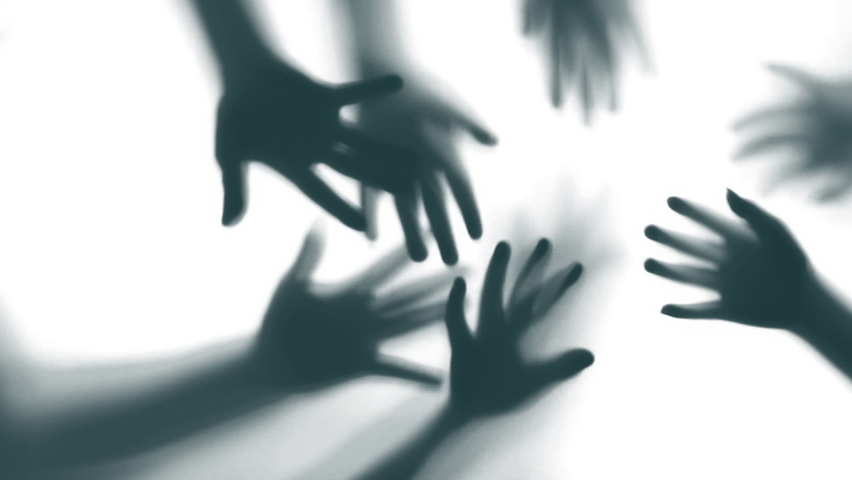 Shadow of a zombie hand on white background
 | Shutterstock HD Video #1090316331