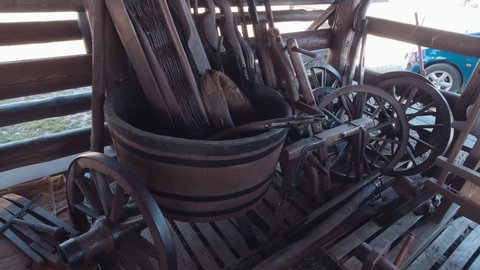 Old tools and weaving loom and wooden wheels