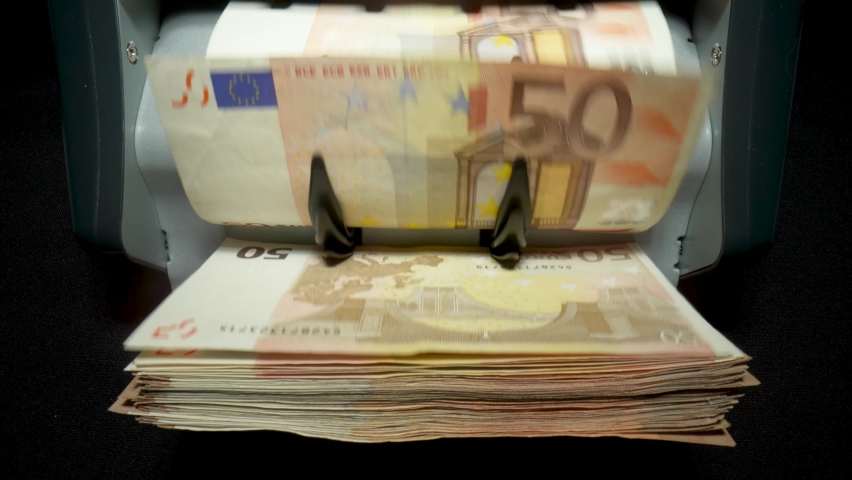Money counting equipment for paper money calculation. Automatic mechanism for bank financial operations. Close up of euro banknotes while being counted Royalty-Free Stock Footage #1090317263