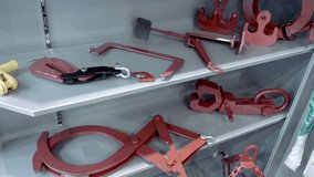 New industrial clamps, grips and holders for holding, lifting and fixing objects while loading, moving and holding. Close up. Shot in motion