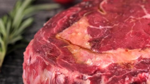 Tomahawk ribeye steak, Irish beef, drizzled with oil. High quality 4k footage