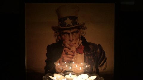 Torrox, Malaga  Spain - 05 09 2022: Uncle Sam image with candles lighting