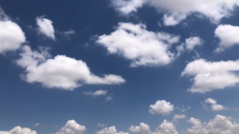 Beautiful white clouds in a blue sky background. Cotton clouds in blue sky. Natural view of clouds. Meteorology and environment concept background. Cumulus clouds background. Drone high view.