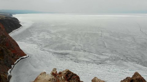 Beautiful winter landscape. Frozen Lake Baikal. Top view of the frozen lake.