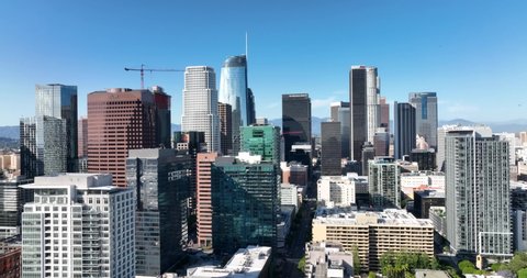Skyscrapers of Los Angeles downtown, fly LA by drone, top aerial view. Business district, megalopolis, panoramic city. Los Angeles, CA, USA, May 10, 2022.