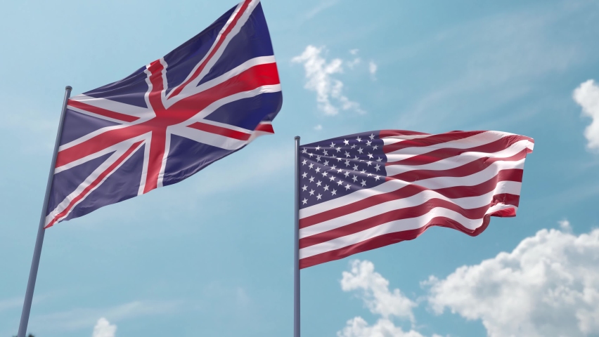 UK and USA flag on flagpole fluttering fast in strong wind in blue sky Royalty-Free Stock Footage #1090341267