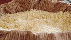 Rice texture close-up. Harvest season. Uncooked white rice top view. Cooking healthy breakfast, vegetarian diet. Food video concept.