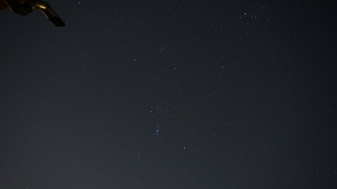 Startrail timelapse on the Orion constellation under a light polluted sky