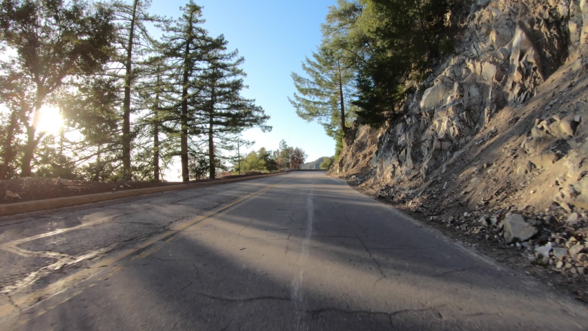 Early morning driving view of Mt Wilson Road in the San Gabriel Mountains in Los Angeles County, California.