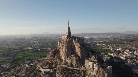 Iconic Jesus statue (Christ of Monteagudo) on rocky outcrop, Murcia; aerial