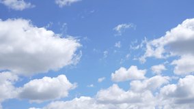 Sunny cloudy sky natural timelapse background. Morning summer cloudscape. 4k stock video time lapse of beautiful peaceful fluffy white clouds flying slowly in clear sunny blue sky backdrop