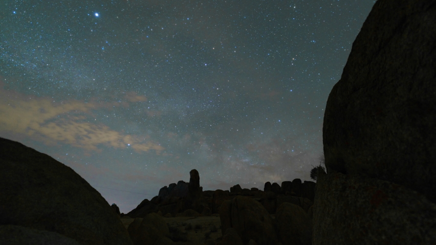 Time lapse tracking shot of Milky Way galaxy rising over rock formations at Alabama Hills in Eastern Sierra, California | Shutterstock HD Video #1090355963