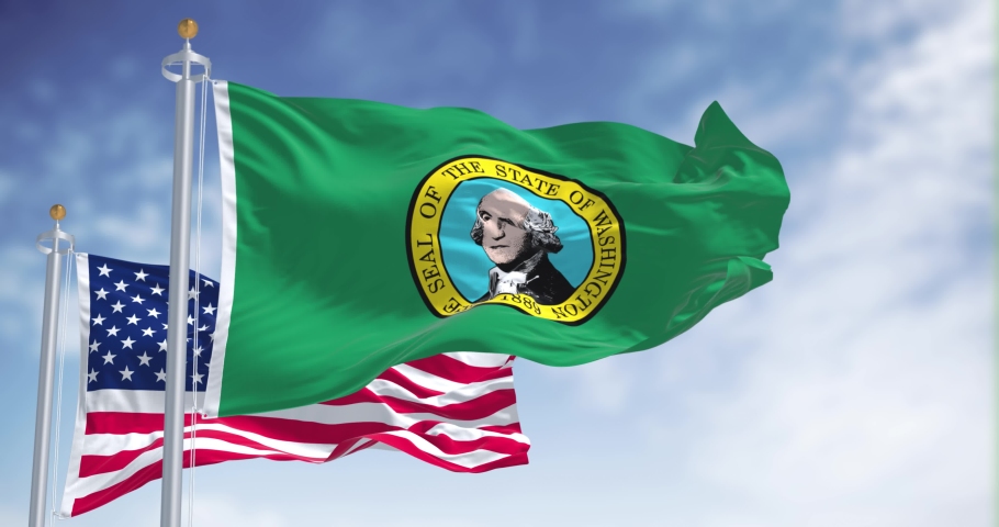 The Washington state flag waving along with the national flag of the United States of America. Washington  is a state in the Pacific Northwest region of the Western United States