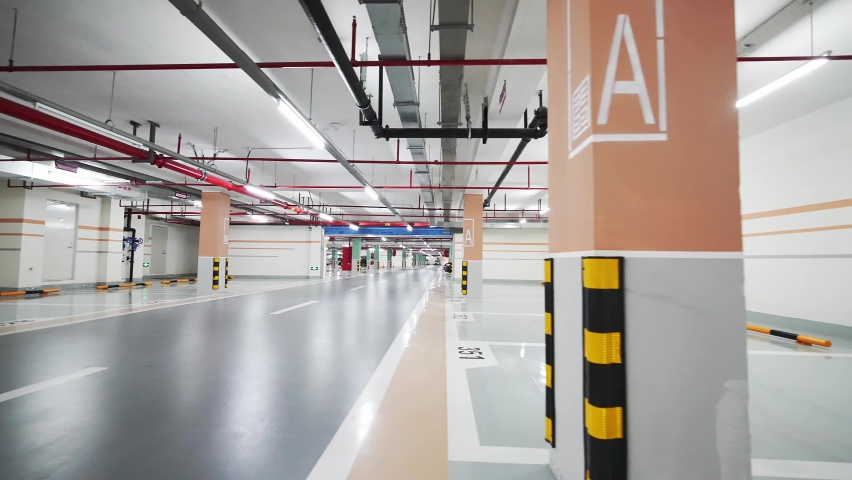 Empty underground parking lot in new residential district | Shutterstock HD Video #1090358099