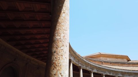 Alhambra, Granada, Spain - July 18 2019 : The distinctive timber ceiling and roof works on the upper level of the Palace of Charles V building.