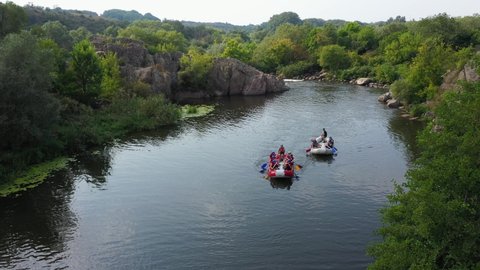 Village Myhiya, Nikolaev region, Ukraine - May 2, 2022: The rafting on a river in the red rafts.