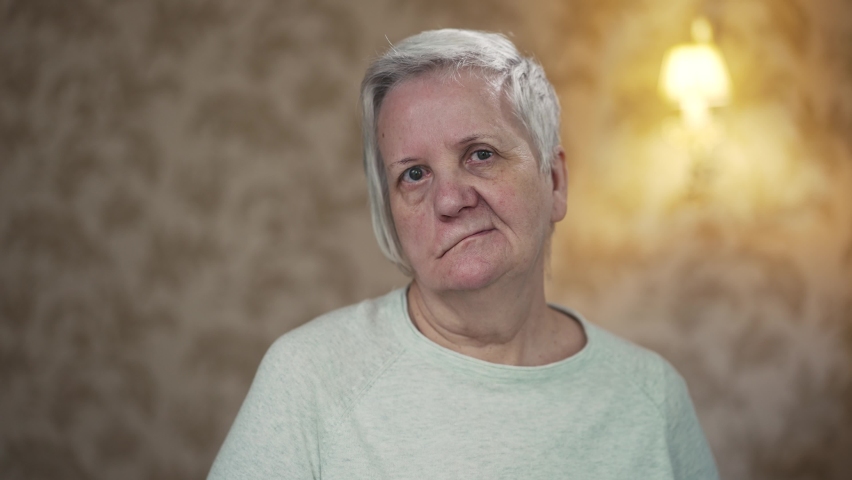 Elderly woman with facial paralysis Royalty-Free Stock Footage #1090361795