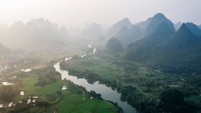 Aerial footage of beautiful mountain and river natural landscape in Guilin at sunrise, China. 