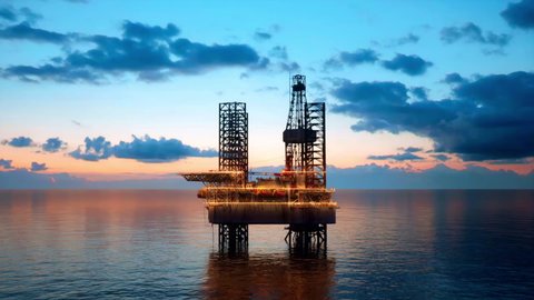 A close-up view of an offshore oil and gas production platform at dusk.