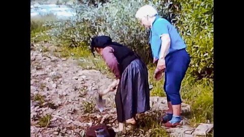 Stob, Bulgaria, 1963 - Hiker helps a nice old peasant woman in hoeing