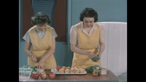 1940s: One woman looks at a bruised peach, while other arranges a tray of fruit. They continue to unwrap peaches. One puts the tray in the refrigerator, while the other puts apples in a basket.