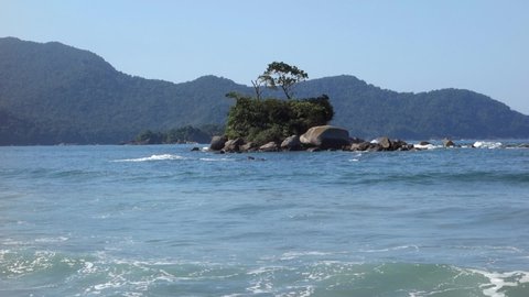 small islet in Castelhanos paradisiac wild beach in Ilhabela island. Sao Paulo coastline, Brazil