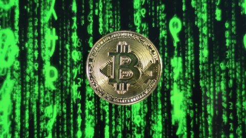Bitcoin BTC physical coin on green digital matrix background. Crypto currency, Closeup