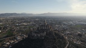 Monteagudo castle and surrounding landscape, Murcia in Spain. Aerial drone circling. Sky for copy space