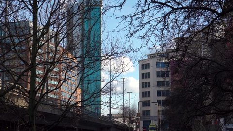 BIRMINGHAM, UK - 2022: Birmingham city centre generic view through trees