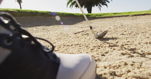 Video of foot of caucasian man playing golf on golf field. sporty, active lifestyle and playing golf concept.