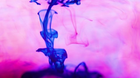Slow motion ink flow in water. Color paint drops in water, abstract color mix , drop of Ink color mix paint falling on water Colorful ink in water, 4K footage,