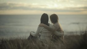 comforting friendly hug friends hugging empathy compassion sunset slow motion watching sunset at the beach - Powered by Shutterstock - Get 15% off with code: PIKWIZARD15