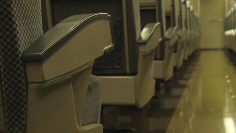Nagoya.Japan-October 31.2019: Closeup shot of seats inside an old train wagon. Beige and black interior. Railway museum in Nagoya Japan. Camera slowly turning right. Selective focus.