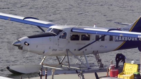 Vancouver , Canada - 03 19 2022: Harbour Air Floatplane Landing At Vancouver Harbour Flight Centre At Coal Harbour