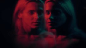 Dual personality. Multiple identity. Mental issue. Creative surrealism. Defocused woman double exposure silhouette in red neon light on dark background out of focus. - Powered by Shutterstock - Get 15% off with code: PIKWIZARD15