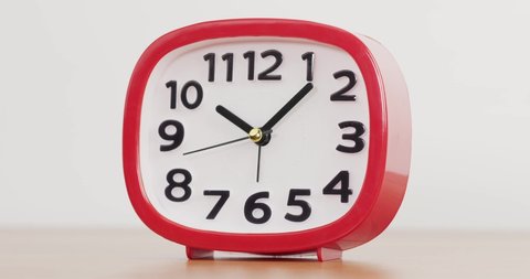 Red Alarm clock isolated on white background, Showtime 10.07 am.