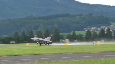 Zeltweg Austria SEPTEMBER, 6, 2019 Combat aircraft of the 1950s and 1950 in flight at low altitude close to the mountains after full afterburner power take off. Saab J-35 Draken of Swedish Air Force