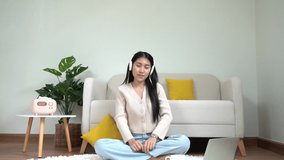 Young smiling woman happy listen music for chill and relax in summer holiday. Lifestyle girl using dancing in living room at home.  Lifestyle Concept 