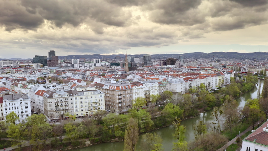 Aerial view of wien Stephansplatz complex drone shot Danube water canal river in Vienna Austria european country historical part border with modern rhythm road traffic cars panorama urban architecture