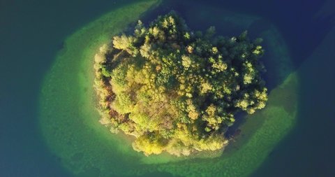 Top view above the green island in the lake