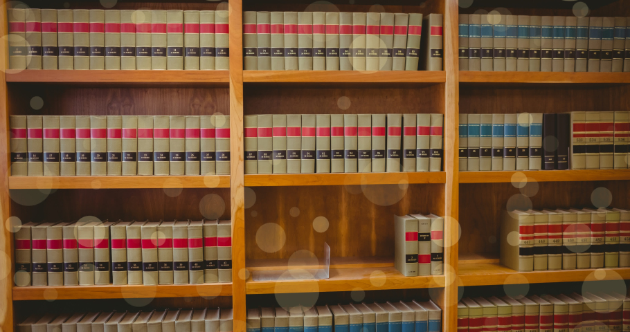 Animation of spots and world map over books in library. global business and digital interface concept digitally generated video.