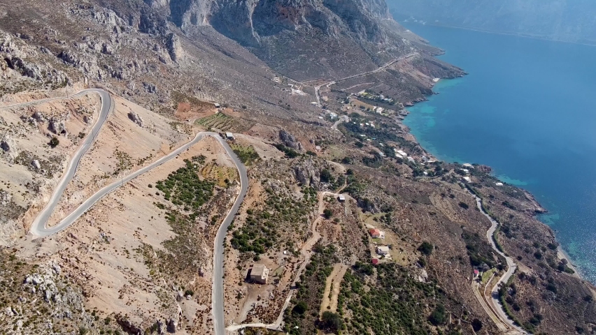 Aerial footage of mountain road with monastery on the pass. Kalymnos island, Greece.