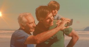 Animation of bokeh over happy grandfather, father and son taking selfie on beach. family, relationship and spending quality time together concept digitally generated video.