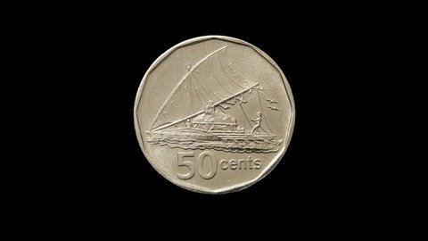 Rotating reverse of Fiji coin 50 cents with image of catamaran and minted from 1975 till 2010. Isolated in white background.