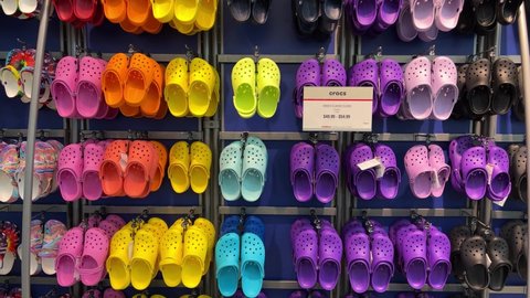 Springfield, IL USA - May 2, 2022: Rows of Crocs shoes at the Scheels Sporting Goods store in Springfield, Illinois.